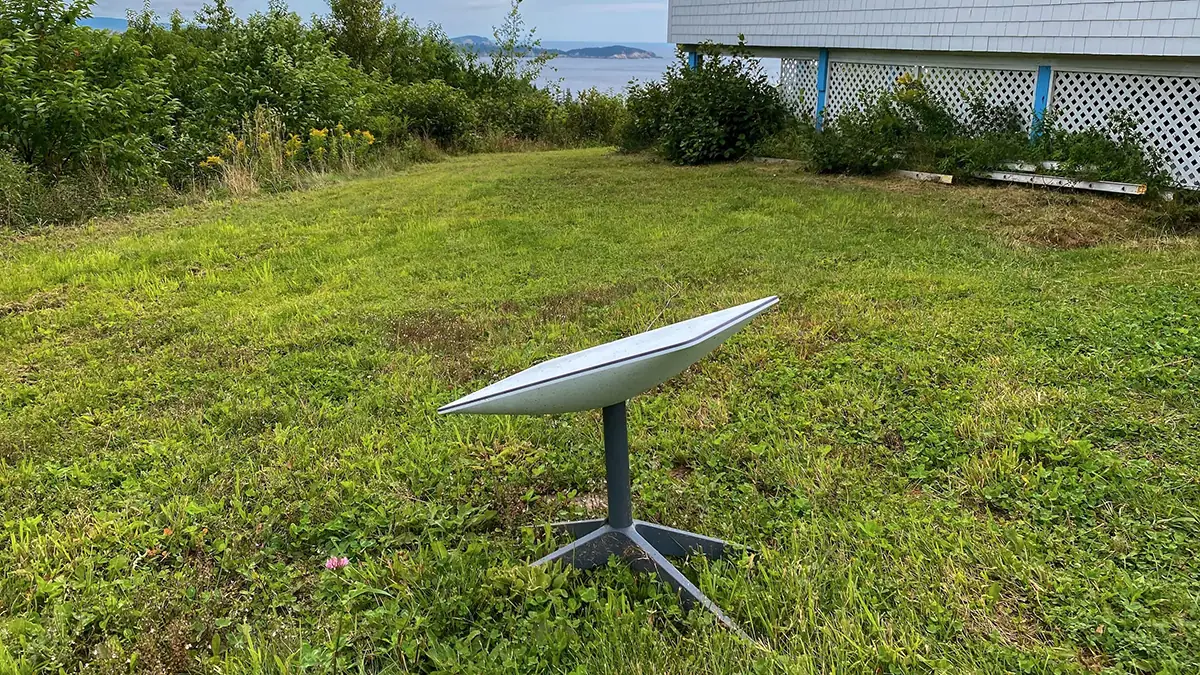 A Starlink dish installed on a lawn